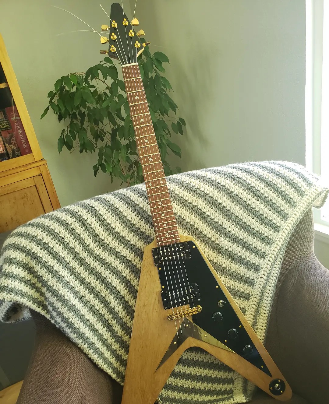 An orphan Flying V kit guitar, finished in nitro lacquer, Gotoh tuners, Tone Pros bridge, CTS and Switchcraft components