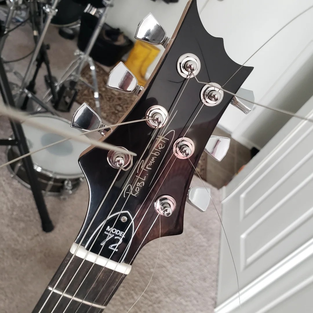 Model 72 headstock with Rob's signature in pearl irridescant, custom engraved truss rod cover