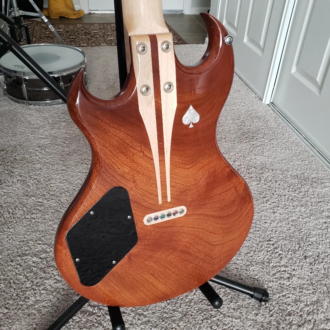 Back of the Model 72 with custom maple spline stiffeners and pearl spade inlay