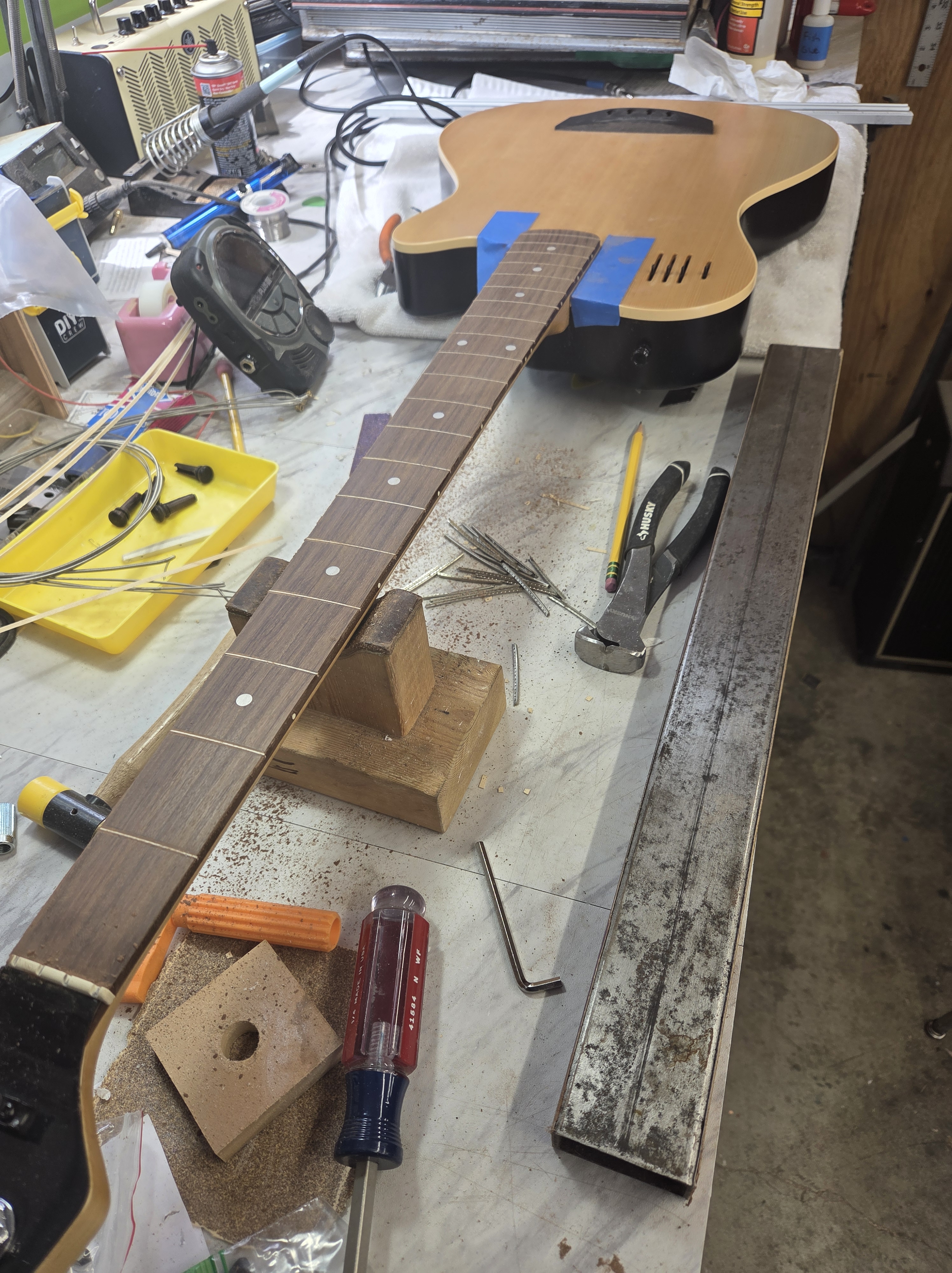 Fretless conversion in progress on this Godin bass